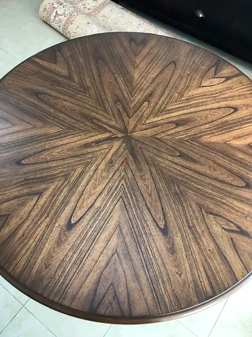 Round wooden table with chairs