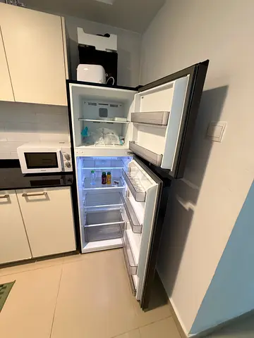 Slim black fridge-freezer, good working condition