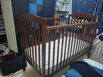 Used wooden baby crib with mattress - sturdy classic design