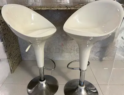 Pair of adjustable white modern bar stools with chrome base