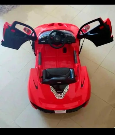 Red electric ride-on toy car for kids with working doors