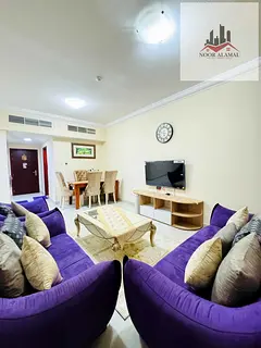 Sharjah Al Taawun, two-bedroom apartment with living room, kitchen, and two bathrooms