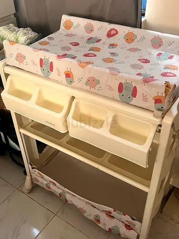 Used baby changing table and bath with padded changing mat and storage drawers