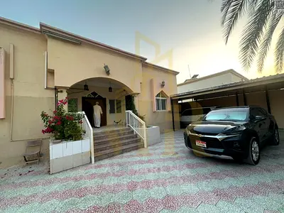 Villa in Al Muwaihat 3, Ajman, steps away from the school complex and the Saudi German Hospital. Includes electricity, water, and air conditioning. 64