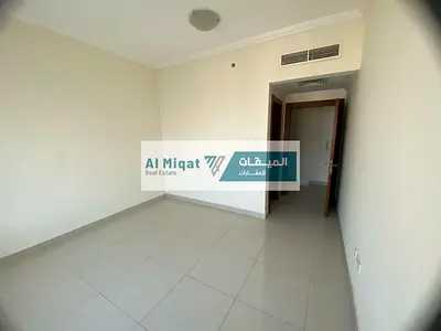Two-bedroom apartment with a living room and maid's room for rent in Al Taawun, with one month free and no registration fees.