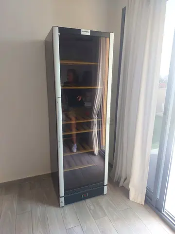 Vestfrost dual-zone beverage cooler features full glass doors and interior wooden shelving