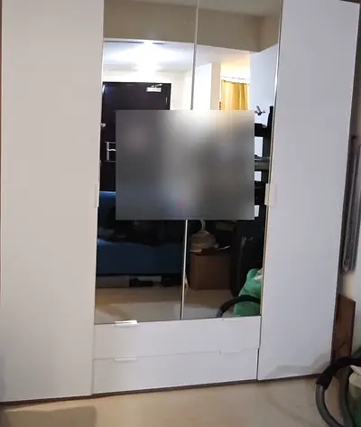 Wardrobe with mirrors and drawers
