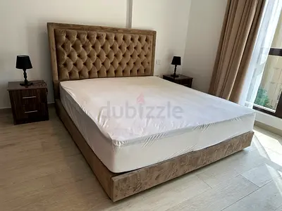 Queen upholstered bed frame with headboard and base (used, good condition)