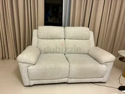 Light grey 2-seater reclining fabric sofa - good condition