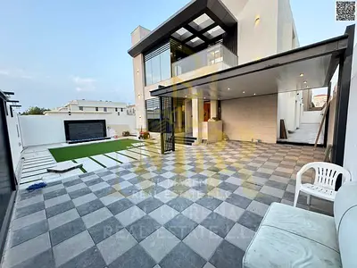 Luxury Villa in Al Muwaihat 2: Modern Design with Yard, Outdoor Seating Area, and Central Air Conditioning - Freehold A luxurious villa in Al Muwaiha