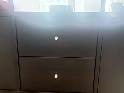 Dark wood 2-drawer bedside cabinet with silver knobs