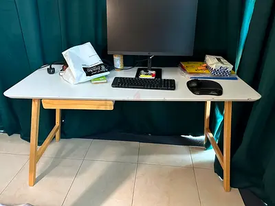 Simple white desk with wooden legs — good condition