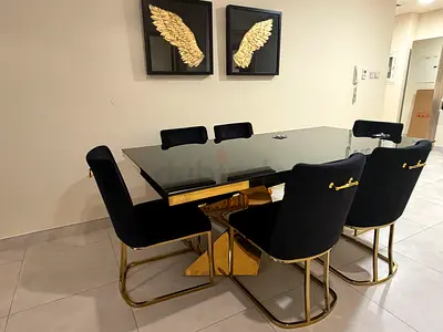 Black Glass Top Dining Table with 6 Velvet Chairs and Gold Frames