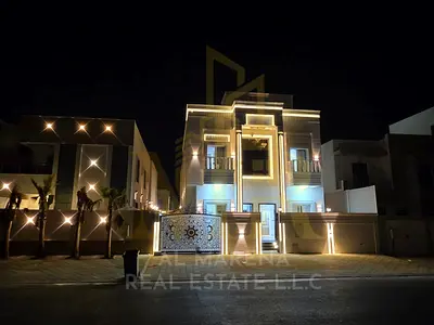 Luxury villa for sale in Al Zahia – Ajman | Two floors + roof | Land area 3,014 sq ft | Built-up area 3,800 sq ft | 5 master bedrooms | Modern design