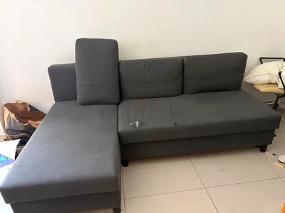 L-shaped grey fabric sofa (right-side chaise) - used - sofa cum bed