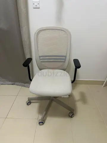 IKEA Light beige ergonomic office chair with mesh back and armrests