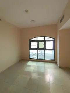 Annual Rent – Al Majaz 2, Sharjah A spacious two-bedroom apartment with an open-view living room, 