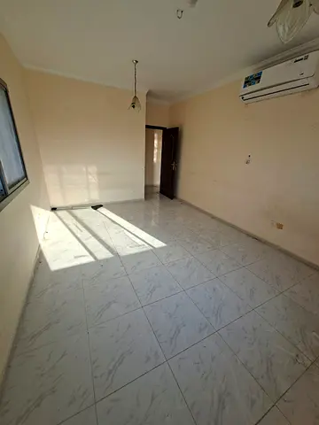 Annual rent in Sharjah Al Majaz 3 Spacious three bedroom apartment with hall 3 bathrooms balcony split AC Prime location Rent 45000 in four payments