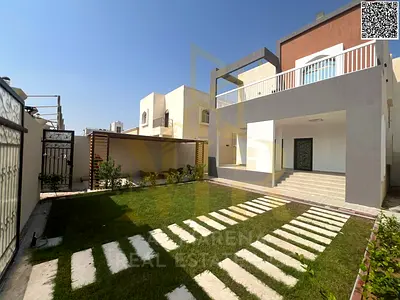 Luxury corner villa with 5 master bedrooms in Al Muwaihat 1, including electricity, water, and air conditioning, at a special price.