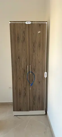 Slim two-door wooden wardrobe / armoire - good condition