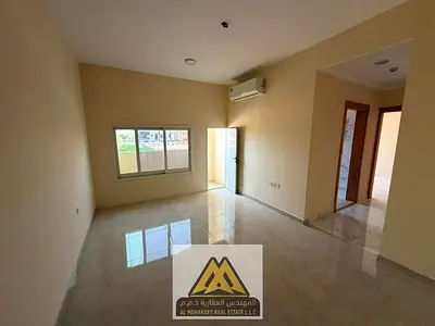 A comfortable family apartment located in Al Mowaihat 1, Ajman, featuring two bedrooms, a spacious living room, balcony, two bathrooms, and excellent