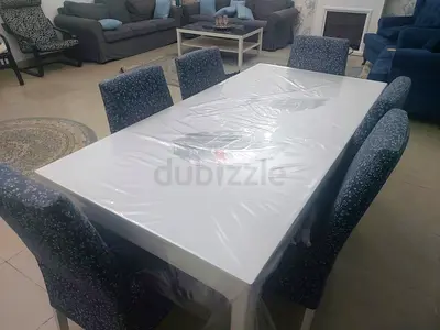 Extendable White modern dining table with 6 upholstered chairs - good condition