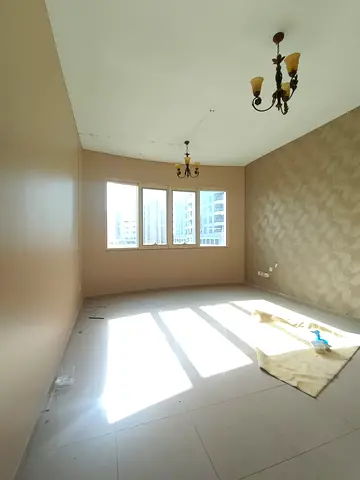 Annual Rent – Al Taawun Main Road, Sharjah A luxurious three-bedroom apartment with a spacious living room and a direct stunning view of Al Khan Lake