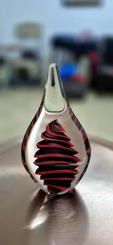 Hand-blown art glass bird paperweight with red internal swirl. Heavy. Home Centre. 12-inch height