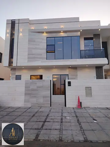 A villa featuring a modern design and spacious indoor and outdoor areas, complete with a swimming pool. The price includes registration and ownership