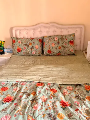 Queen size bed with upholstered headboard and mattress