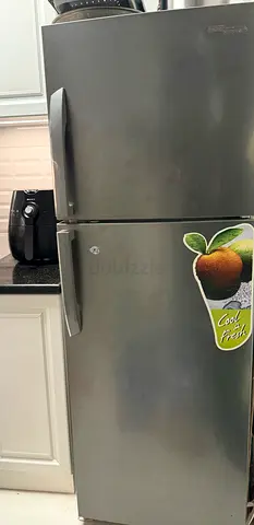 Silver double-door refrigerator, good working condition