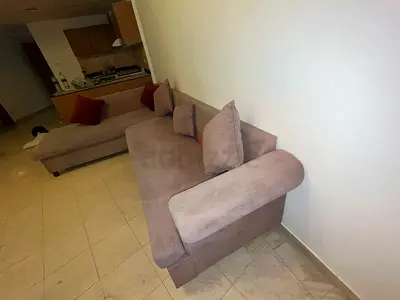 L-shaped beige fabric sofa, good condition