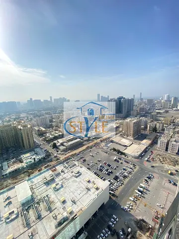 One bedroom and living room for sale in Al Waha Towers. Closed kitchen.