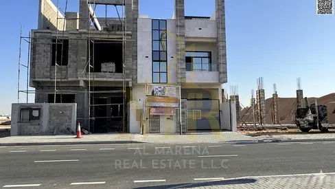 Two-story villa with a roof terrace in Al Zahia, featuring five master bedrooms, a living room, a hall, and a modern kitchen. Price negotiable, includ