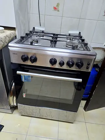 4-Burner Stainless Steel Gas Range with Oven - Good Working Condition
