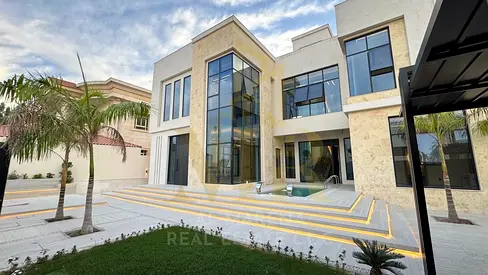 Luxury villa in one of Ajman's most prestigious areas, featuring a private pool, electricity, water, and air conditioning included, for a truly upscal