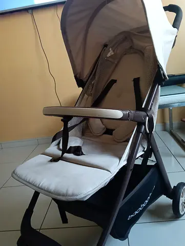 Lightweight beige baby stroller in good condition