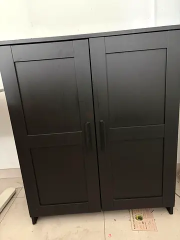 Dark brown two-door storage cabinet / wardrobe - compact