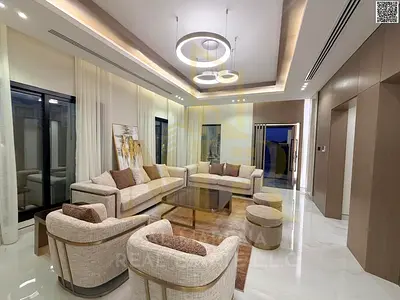 Luxury two-story villa with a rooftop terrace, located behind the Saudi German Hospital and near a school complex. Features include an elevator, and c