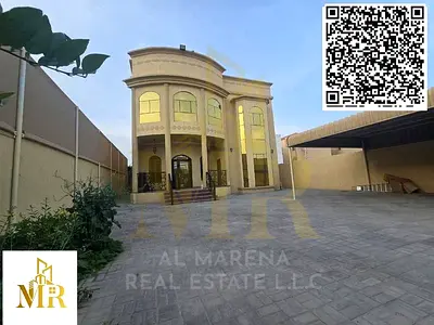 Modern villa for sale in Al Muwaihat 1 area, Ajman. Two floors plus a roof terrace. Excellent location opposite a park and mosque. Price includes elec