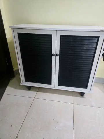 Small White Storage Cabinet with Black Roll-Top Doors