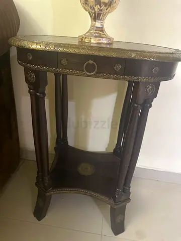 Antique-style wooden side table with brass inlay