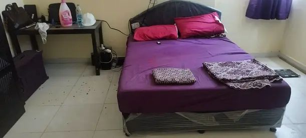 Queen size bed with mattress and purple bedding - good condition