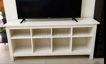 White wooden TV console with 8 open cubbies - good condition