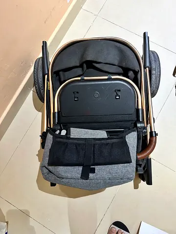 Foldable pram stroller in good condition — compact and easy to store