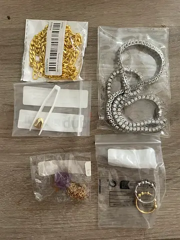 Mixed jewelry lot — chains, bracelets, rings and pendants (6 pieces)