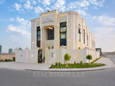 Corner villa on two streets in Al Helio 2, Classic style | Luxurious location and exquisite design, registration fees included.