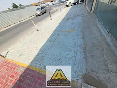 New shops with large spaces suitable for all activities in Ajman Industrial Area 2, on a main street