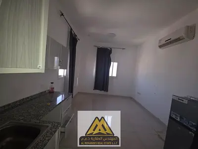 A spacious studio apartment with a semi-separate kitchen in Al Rashidiya 3, close to the Ruler's Palace and all services and main roads.