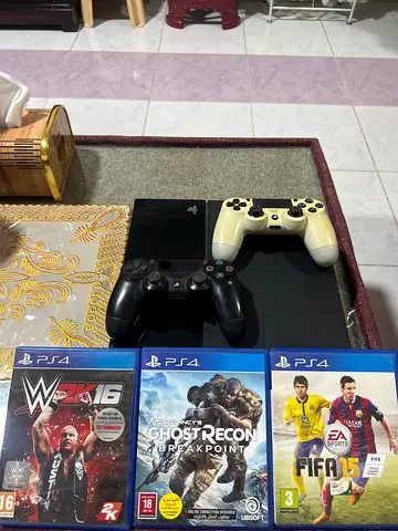 PS4 with 2 Controllers + 3 Games (FIFA 15, Tom Clancys Ghost Recon, WWE 2K16) - Good Condition